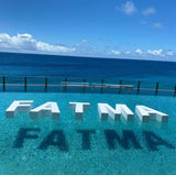 Floating FATMA swimming pool sign
